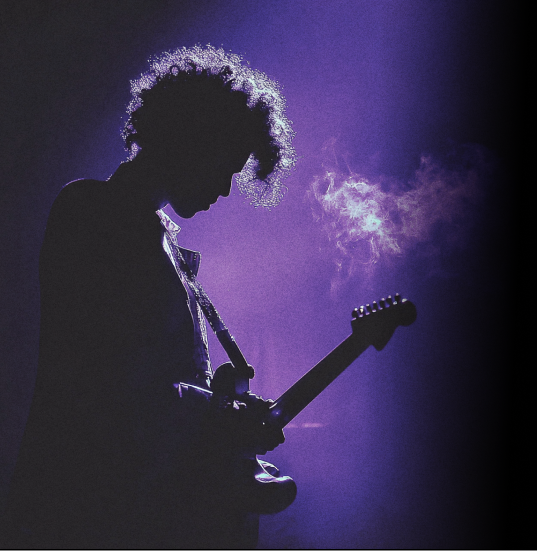 Guitarist silhouette draped in purple lighting